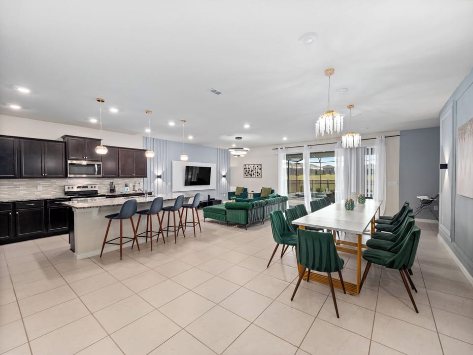 Spacious Downstairs Area with Full Size Kitchen, Dining Table, and Comfortable TV Lounge