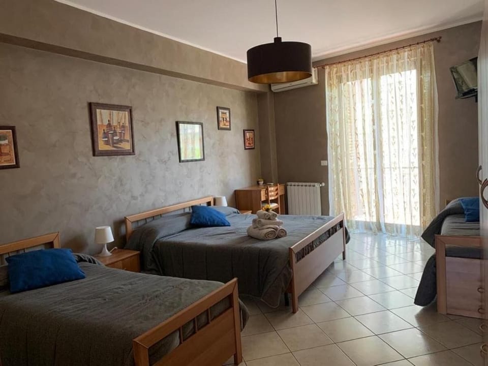Family Quadruple Room, Balcony, City View | In-room safe, desk, iron/ironing board, free WiFi
