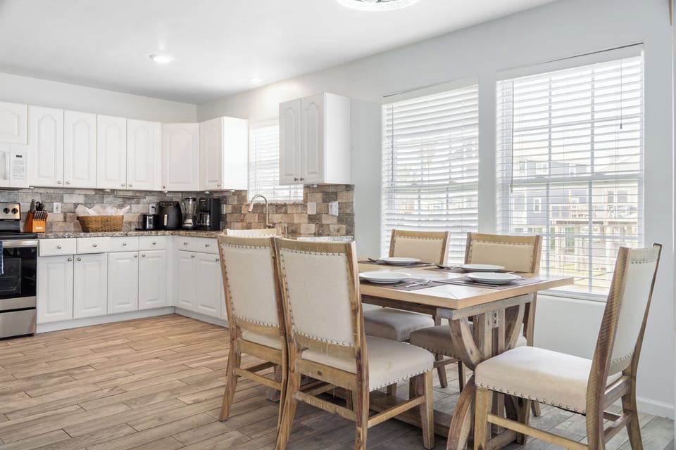 Open concept kitchen with dining room table.