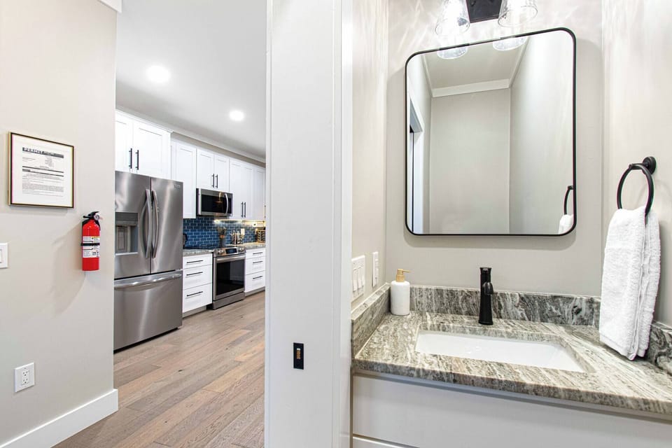 Powder room, located right off the front door entry