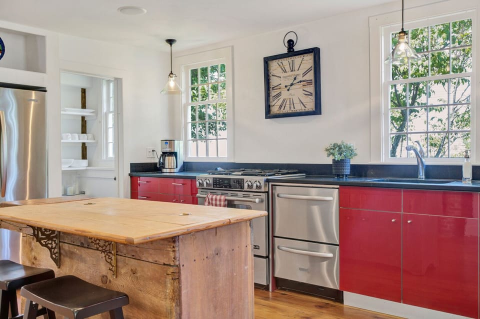Kitchen with Stainless Appliances and Vintage Clock