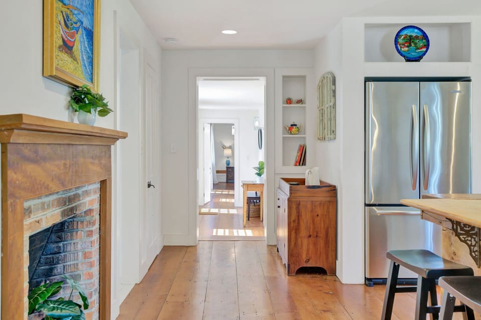 Hallway with Fireplace and Built-In Shelving