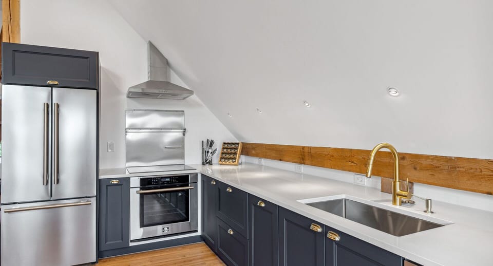 Fully equipped kitchen with stainless appliances and wall oven