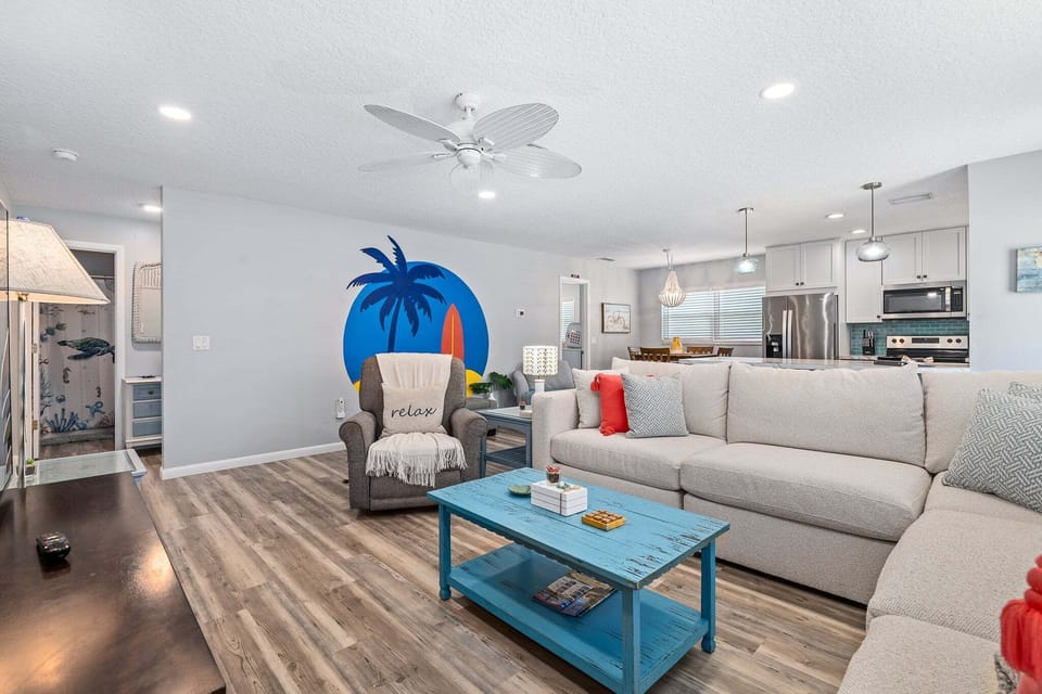 The layout flows seamlessly into the kitchen and dining areas, making it easy to stay connected while cooking or entertaining.