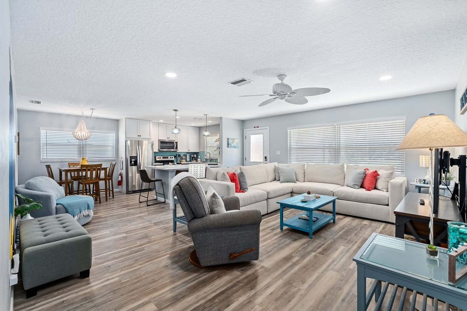 The living room features an open floorplan that creates a bright, airy space perfect for gathering and relaxing.
