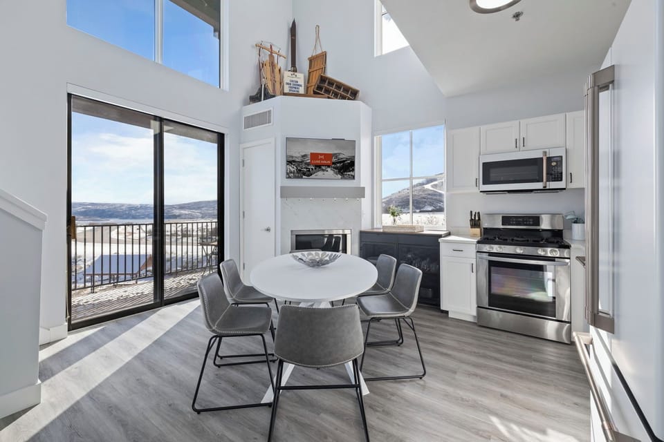 Bright kitchen with dining area and lake view.
