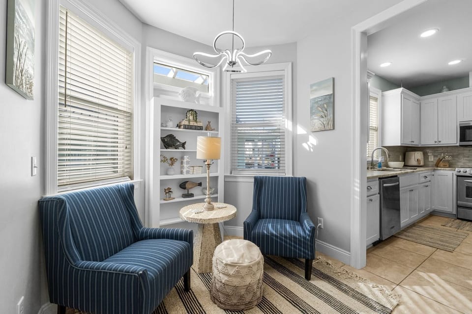A cozy and functional space in the hallway featuring comfortable seating, perfect for a quick break or intimate conversations.