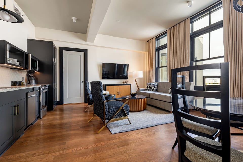 A cozy living area with a mix of neutral colors and contemporary design elements.