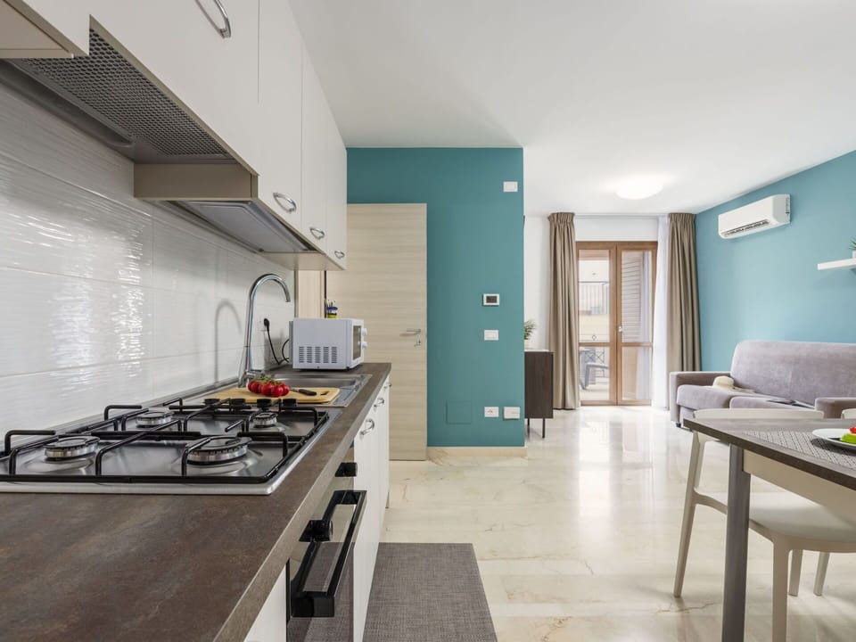 Flooring, Interior Design, Kitchen, Countertop, Wood, Floor, Furniture, Major Appliance, Cabinetry, Kitchen Appliance