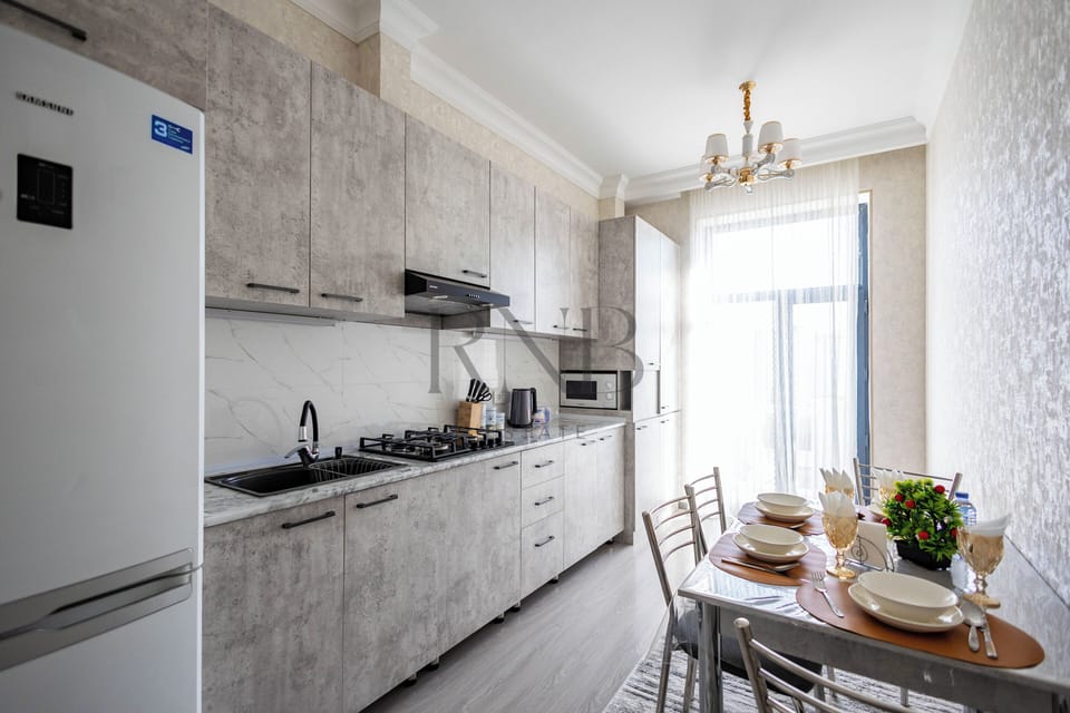 Family Condo, Balcony, City View | Private kitchen | Electric kettle