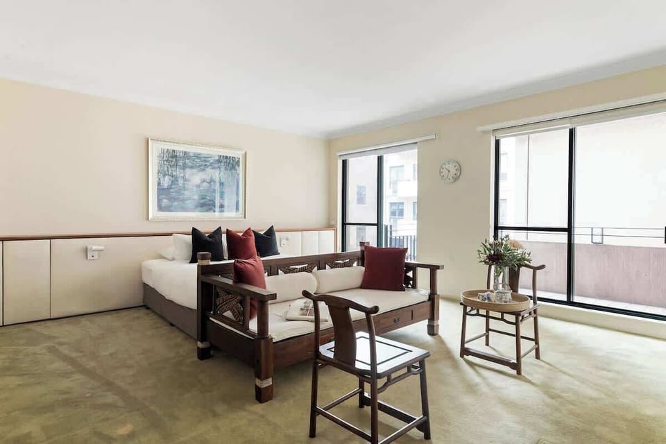 The master bedroom with a king sized bed & balcony.