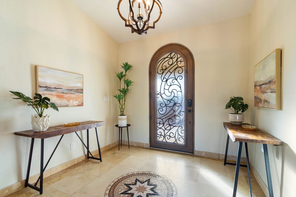 Inviting front door adorned with wrought iron accents