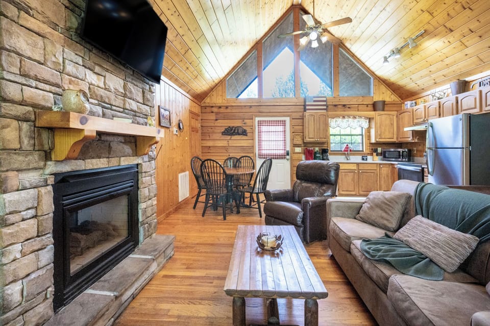 Living Room: Stunning wood accents and a stone fireplace create the perfect gathering spot!