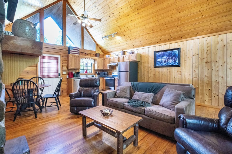 Living Room: Inviting space with wood accents, comfy seating, and natural light.