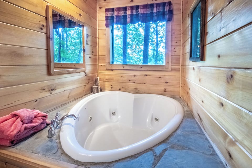 Enjoy a relaxing soak in the private hot tub and melt away your stress.