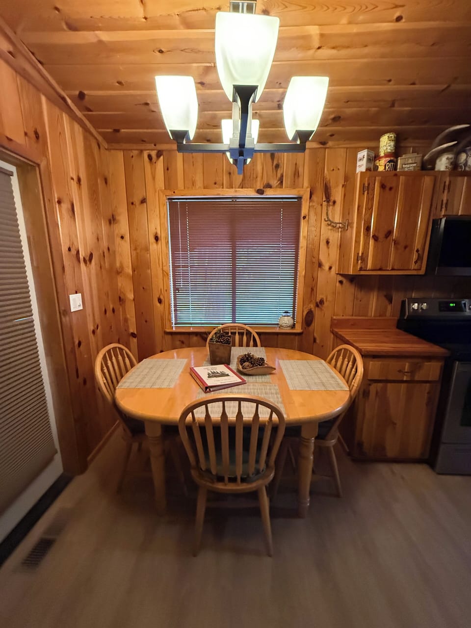Dining table 2 extra chairs and leaf in the den