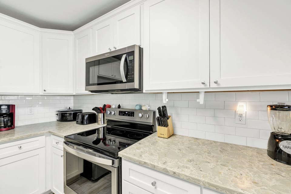 Your fully equipped kitchen awaits with granite counters, stainless appliances, and everything needed for home-cooked meals during your stay.