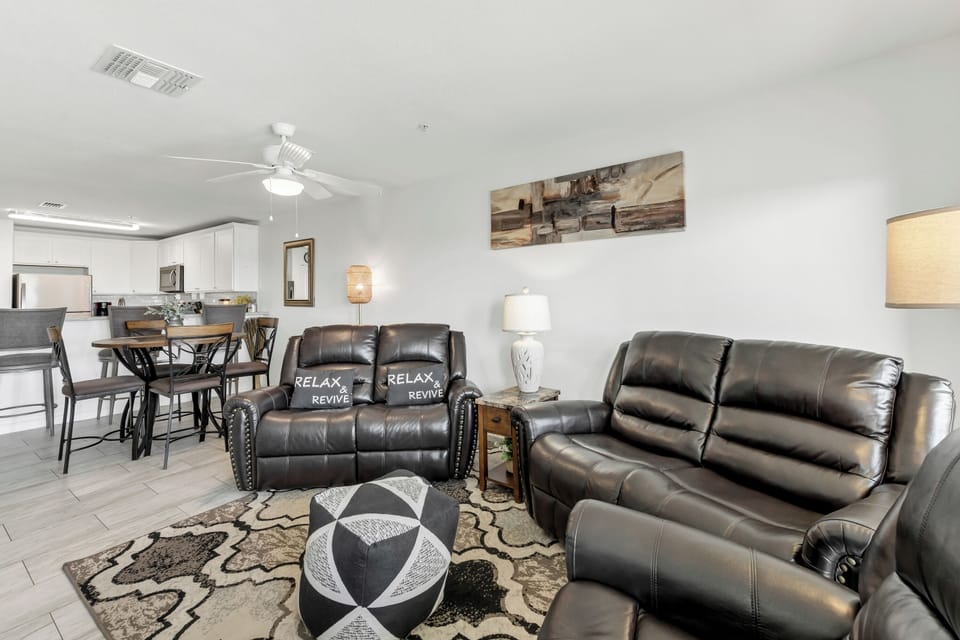 Sink into plush leather recliners and unwind in your spacious open-concept haven, where comfort meets style.
