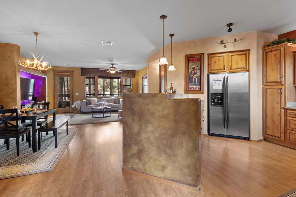 The condo’s open layout seamlessly blends the living, dining, and kitchen areas, creating a spacious and inviting atmosphere perfect for relaxation and entertaining.