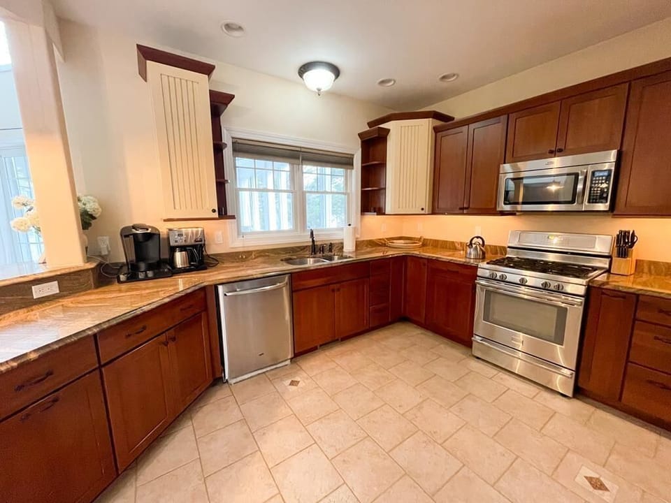 Kitchen: fully stocked, Keurig and 12-cup coffee maker, large pantry.