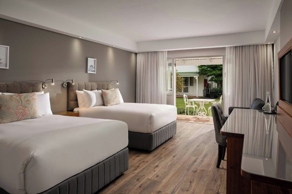 Room, 2 Double Beds | In-room safe, desk, laptop workspace, free WiFi