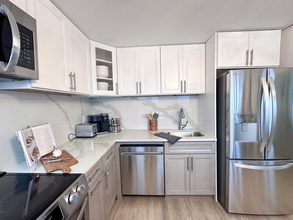 A new kitchen features stainless appliances and is well-stocked for those who want to cook.