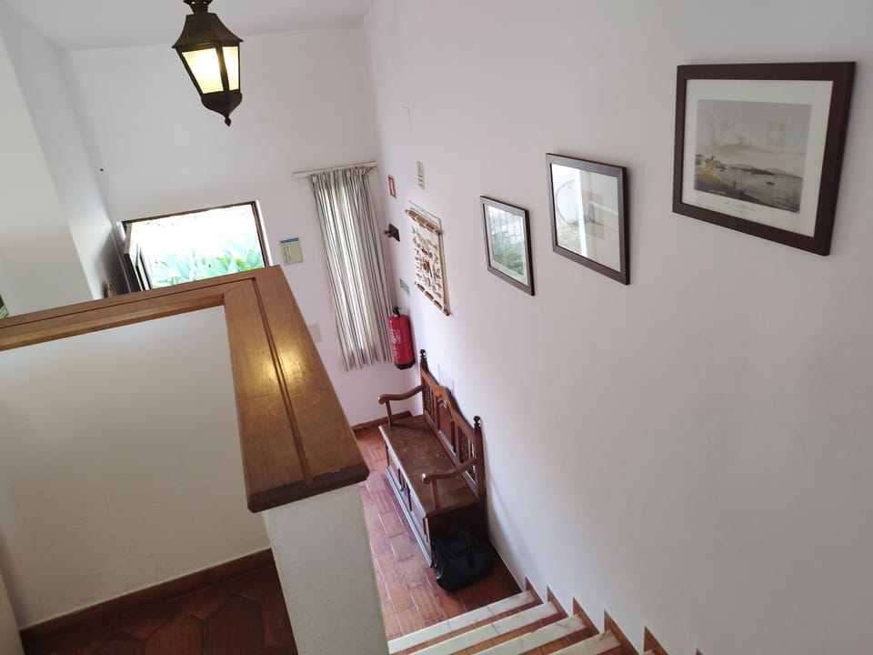 Stairs from the Living Area leading down to the front hall