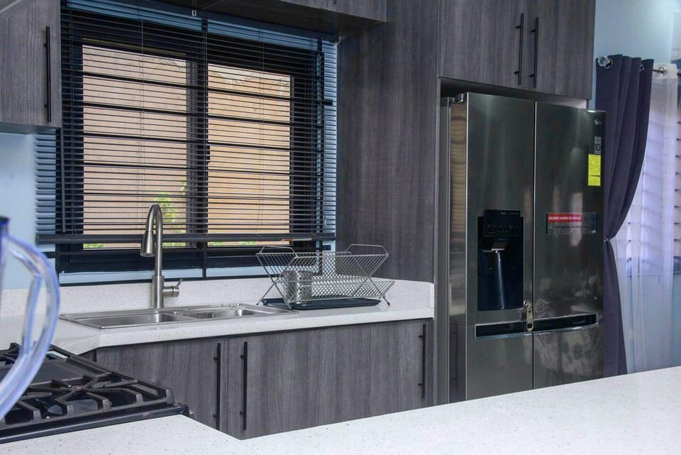 Villa | Private kitchen | Fridge, microwave, oven, stovetop