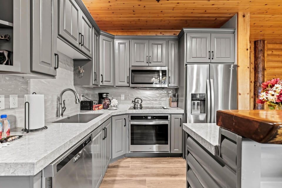 Your kitchen is fully equipped with appliances and bar seating, perfect for prepping breakfast before a day on the slopes.