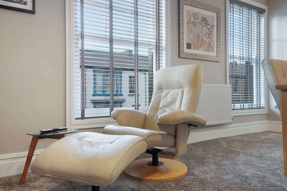 Make yourself at home in the open-plan living, dining, and kitchen area. Featuring an indoor fireplace, Smart TV, and comfortable seating, it's perfect for relaxing together.