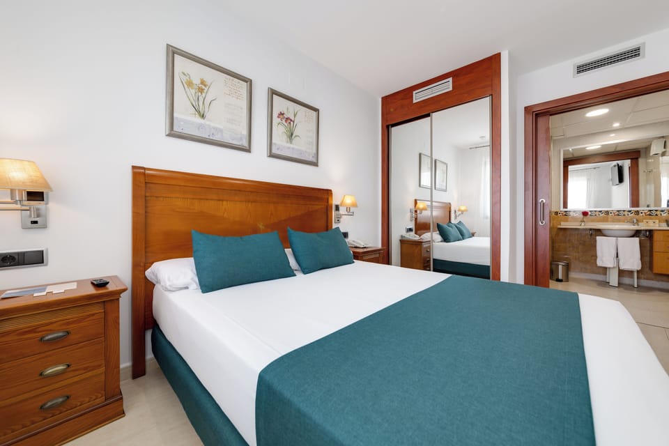 Junior Suite, Balcony, Garden View | In-room safe, desk, iron/ironing board, free WiFi