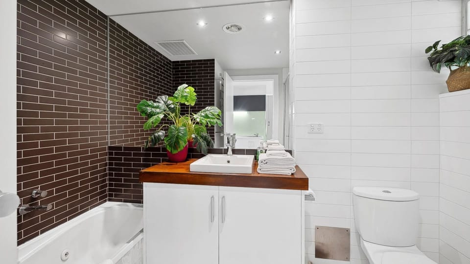 Private bathroom with bath