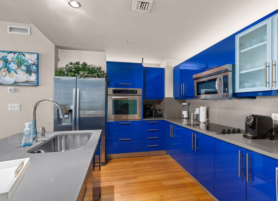 Spacious Modern Kitchen with Vibrant Blue Cabinets