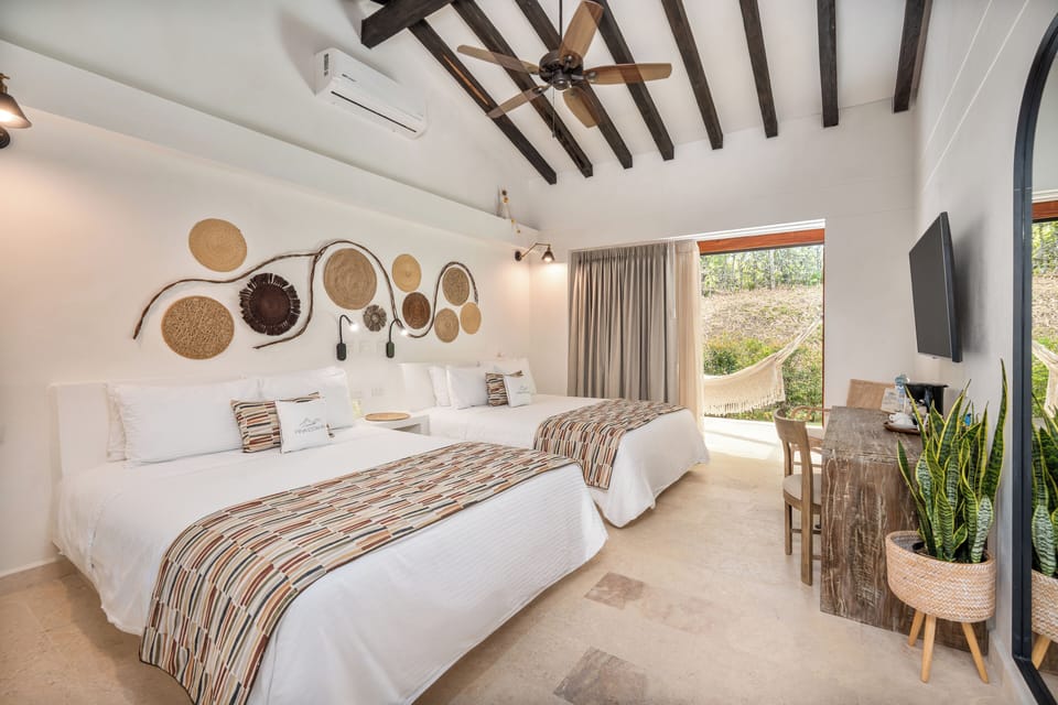 Quadruple Room, 2 Double Beds | Free minibar, in-room safe, desk, blackout drapes
