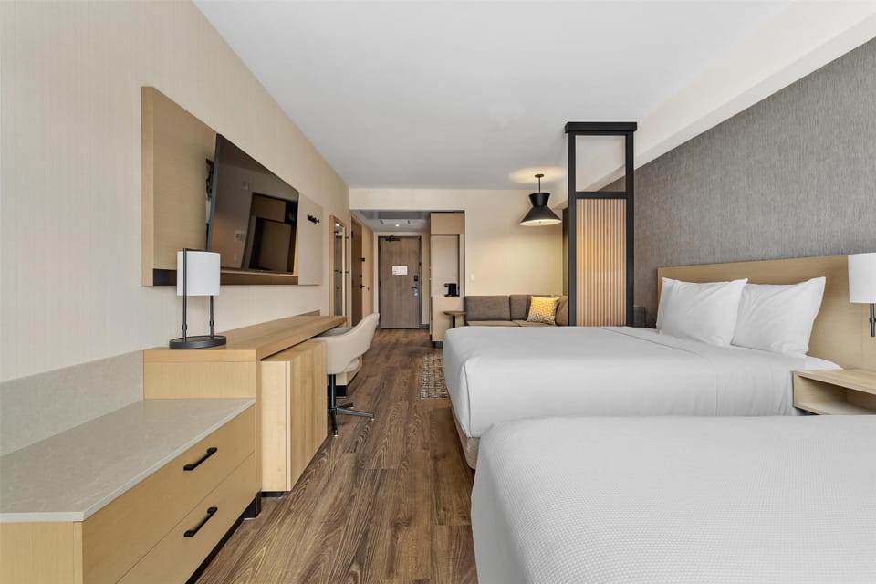 Room, Multiple Beds | Down comforters, in-room safe, desk, blackout drapes