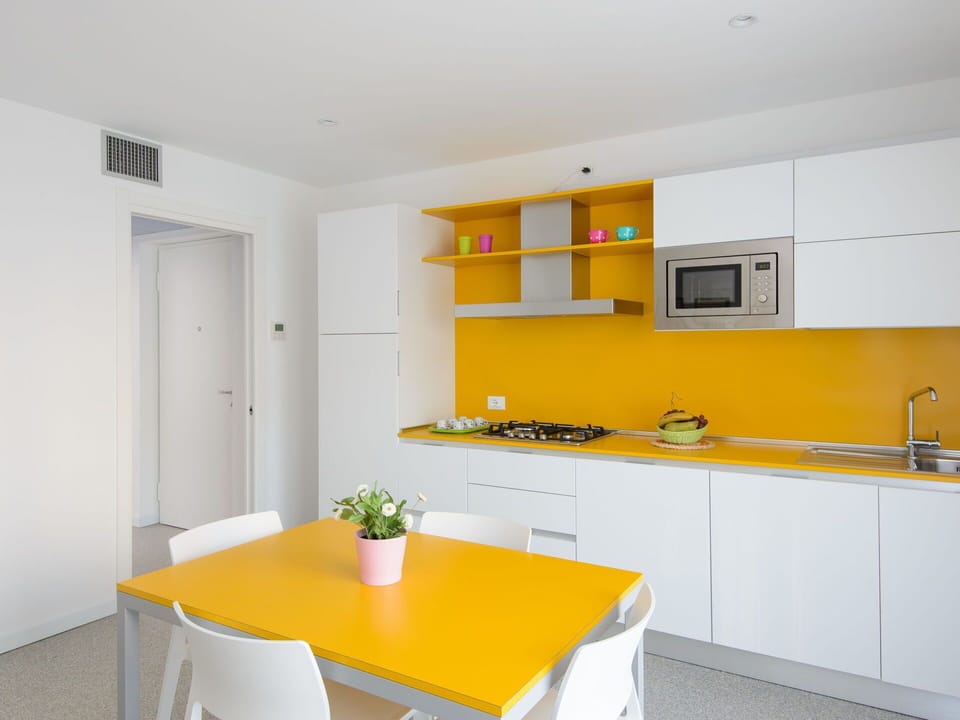 Interior Design, Flooring, Yellow, Floor, Kitchen, Countertop, Ceiling, Furniture, Room, Apartment