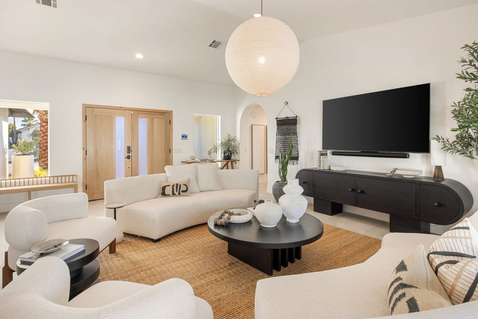 Step back inside to the large great room and cozy up in one of many lounge areas to relax with friends and family.