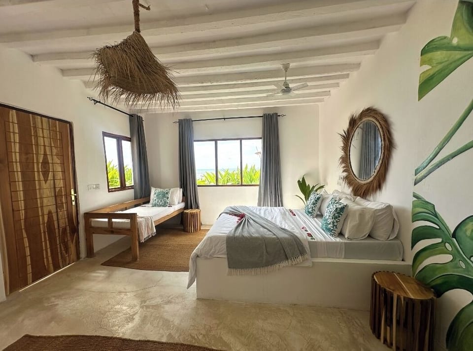 Deluxe Triple Room, Beach View | In-room safe, individually decorated, individually furnished, free WiFi