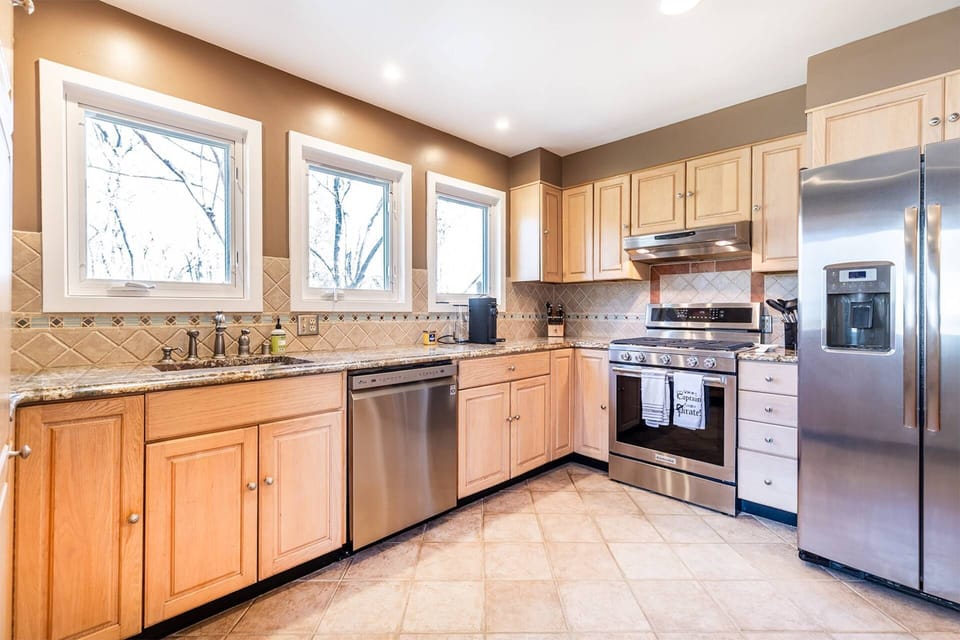 The kitchen is fully equipped with stainless steel appliances, cookware and dining ware for 6 guests.
