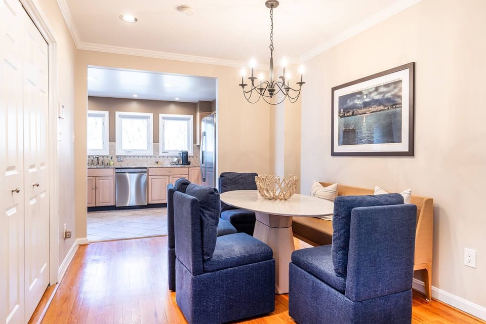 The dining room table comfortably seats 6 guests.