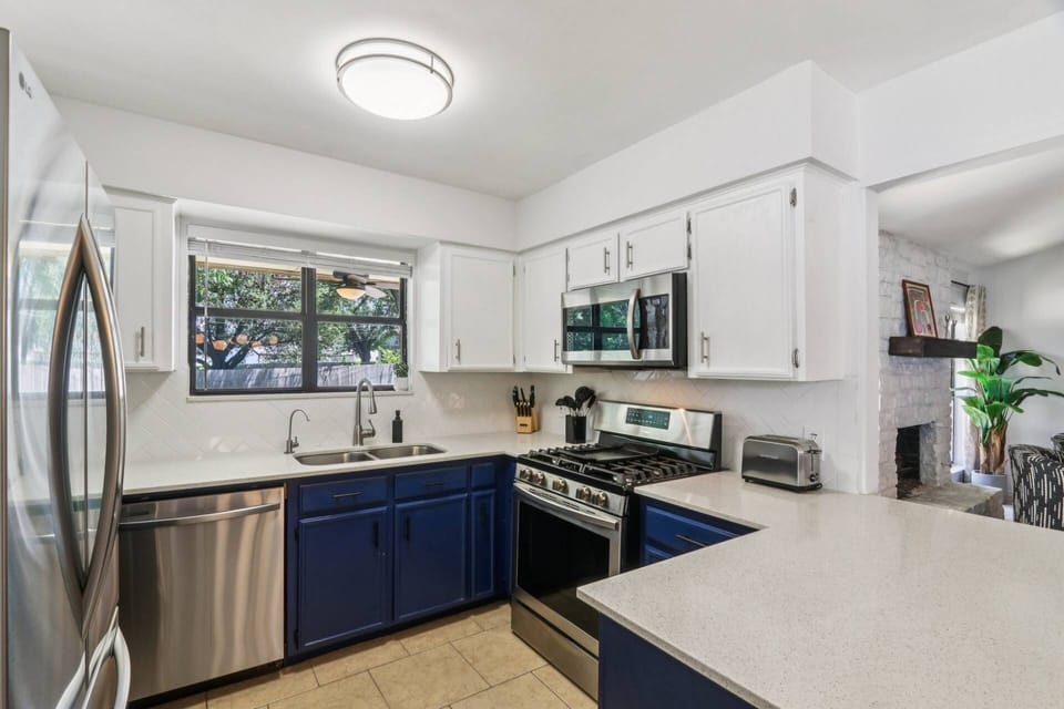 Fully stocked kitchen with new stainless steel appliances