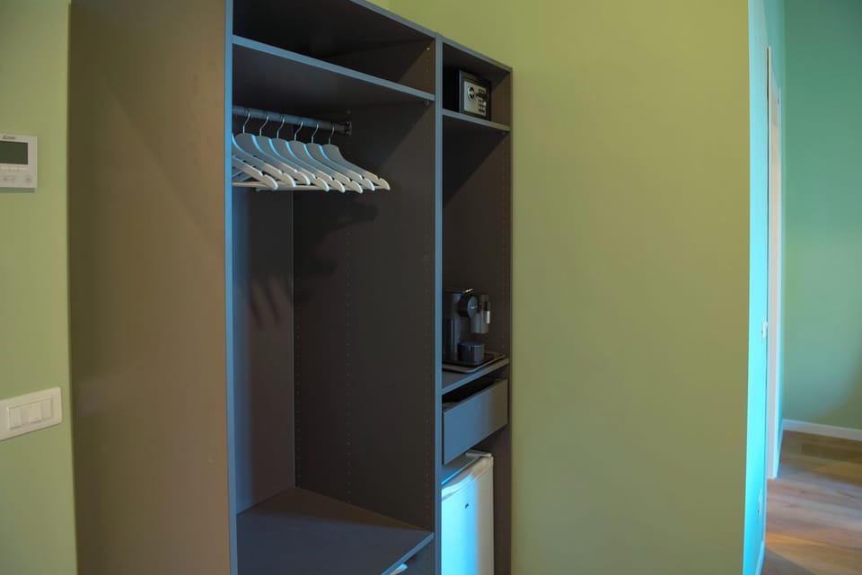Deluxe Triple Room, Balcony | In-room safe, desk, blackout drapes, free WiFi