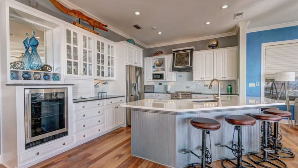 Your gourmet kitchen awaits with granite counters, stainless appliances, and breakfast bar perfect for morning coffee chats.