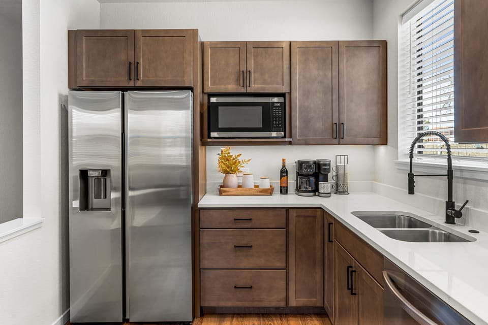 Stainless Steel appliances beam in the updated kitchen