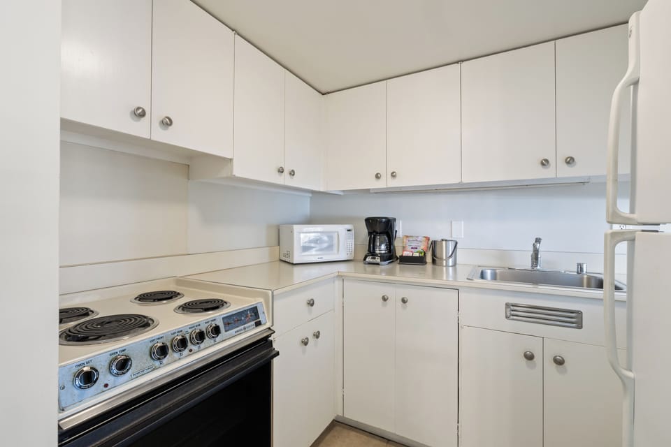 Your fully equipped kitchen features a stove, microwave, coffee maker, and everything you need to prepare meals during your stay.