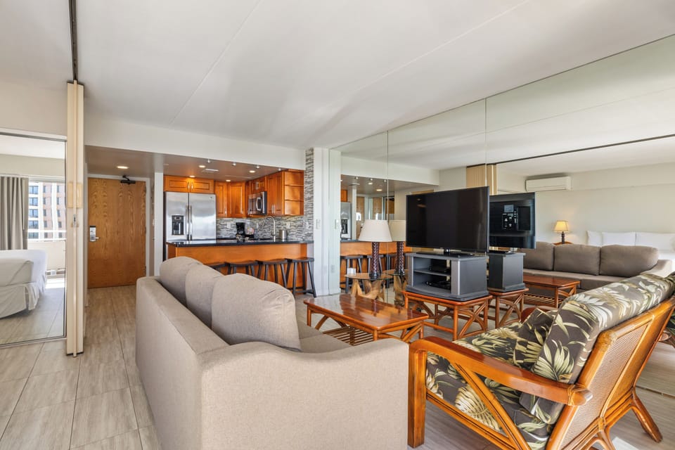 Your spacious open living area features cozy seating, a full kitchen, and flat-screen TV—perfect for relaxing and making yourself at home after a day of adventure.