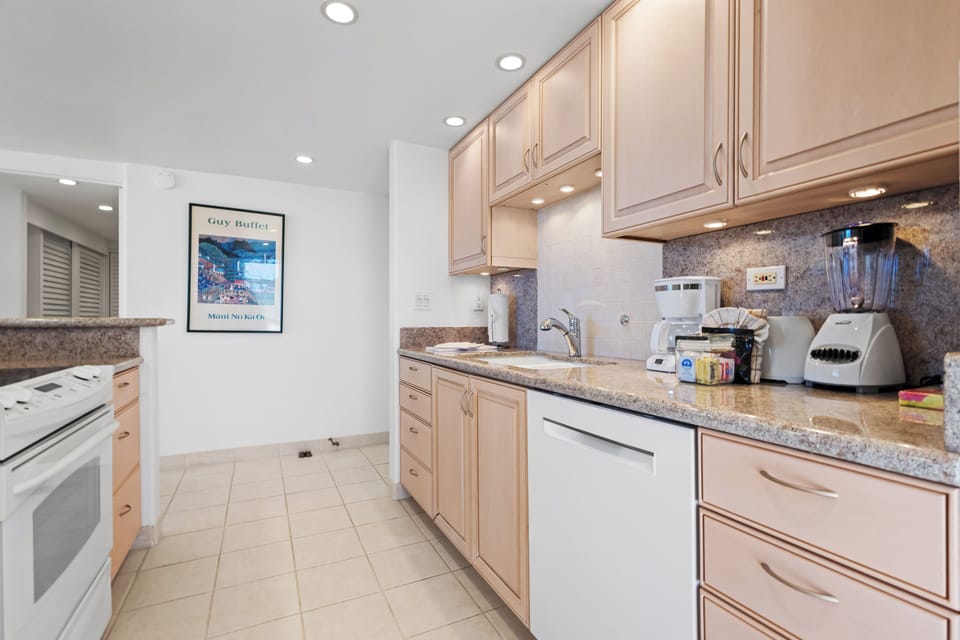 Your fully-equipped kitchen features granite countertops, modern appliances, and ample storage—perfect for preparing home-cooked meals or blending your favorite smoothies during your stay.