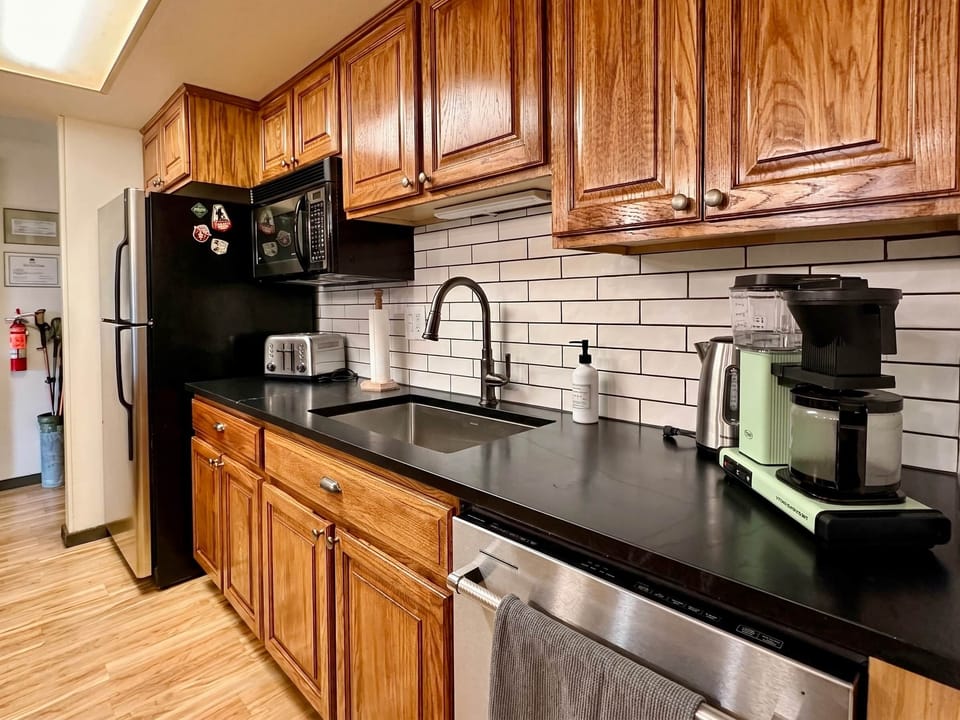 Fully equipped kitchen with many extras like a crockpot, blender, and a wangjangler.