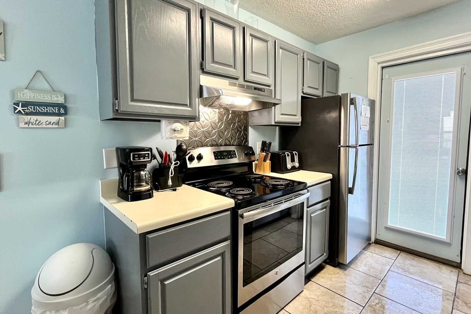 The kitchen is stocked with essentials for preparing meals at home.