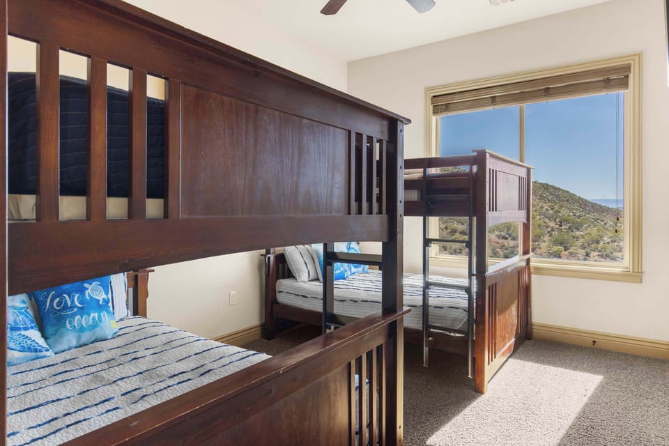 The bunk bedroom offers a pair of full-over-full bunkbeds & Smart TV